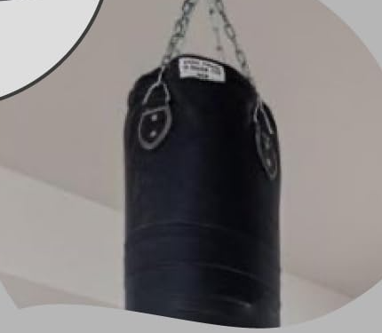 Heavy punching bag hanging from a ceiling hook